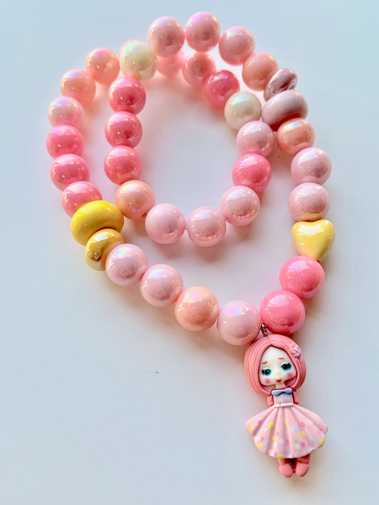 Pink Girl With Her Pink Daisy Flower Necklace by Red Bobble